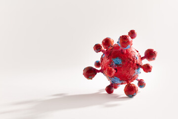 A photograph of a colorful virus sculpture. The artwork inspired by the Covid-19 lockdown of 2020