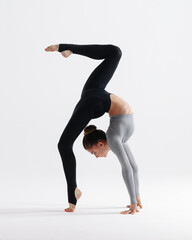 Young gymnast girl stretching and training