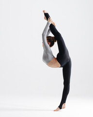 Young gymnast girl stretching and training