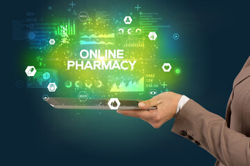 Obraz premium Close-up of a touchscreen with ONLINE PHARMACY inscription, medical concept