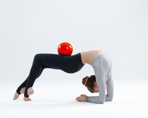 Young gymnast girl stretching and training