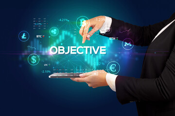 Close-up of a touchscreen with OBJECTIVE inscription, business opportunity concept