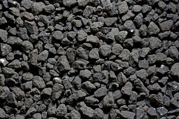 Black small road stone background, dark gravel pebbles stone texture seamless texture,