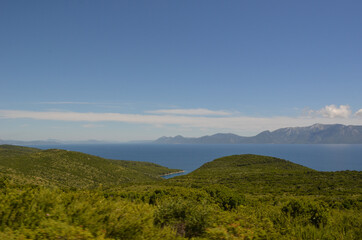 Landscape in Hvar Croatia with greenery, sea, hills and clouds
