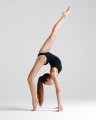 Young gymnast girl stretching and training