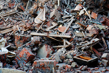Pile of demolition rubble. Gray rubble at a building site. Concrete rubble debris on construction...