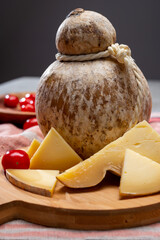 Italian semi hard matured caciocavallo cheese, handmade and aged in natural underground caves in...