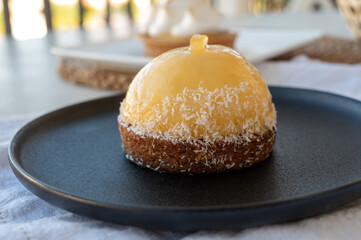 Small yellow  lemon ball tart from French pastry shop
