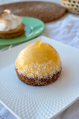 Obraz na płótnie Canvas Small yellow lemon ball tart from French pastry shop