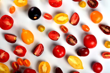 lots of tomatoes on a white background