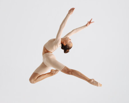 Young gymnast girl stretching and training