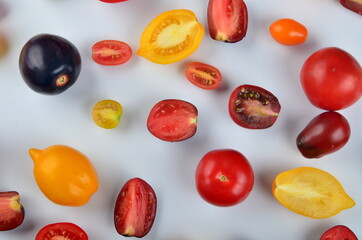 lots of tomatoes on a white background