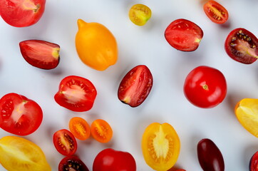 lots of tomatoes on a white background