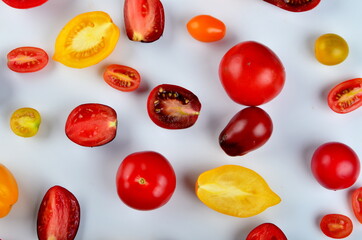 lots of tomatoes on a white background