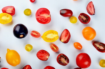 lots of tomatoes on a white background
