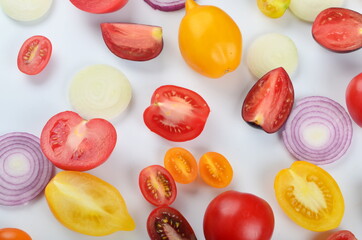 lots of tomatoes, onion slices  isolated on a white background