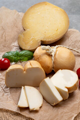 Italian semi hard handmade smoked scamorza and caciocavallo matured in caves cheeses made from cow milk from Apulia or Calabria regions