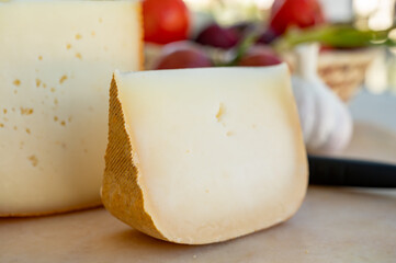 Cheese collection, French fol epi  cheese with many little holes, etorki, tomme noire des pyrenees and ossau iraty cheese
