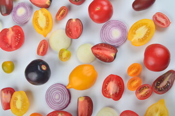 lots of tomatoes, onion slices  isolated on a white background