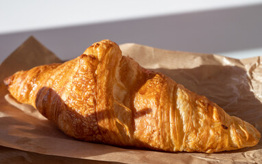 French breakfast in bakery served outdoor, cups of coffee and fresh baked croissants and pastry, morning food