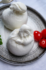 Cheese collection, fresh soft white burrata cheese ball made from mozzarella and cream from Apulia, Italy