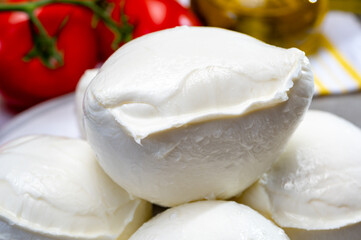 Fresh handmade soft Italian cheese from Campania, white balls of buffalo mozzarella cheese made from cow milk ready to eat