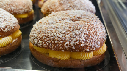 French fresh baked sweet filled brioche pastry tarte tropezienne in confectionery shop in Saint-Tropez, Provence, France