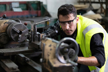 Fototapeta na wymiar engineer man or factory worker milling or working on the machine in factory