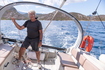 A man sailing a boat in the Mediterranean Sea