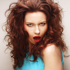 Fototapeta premium young expressive redhair woman