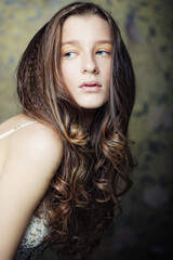 young woman with long curly hair