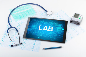 Close-up view of a tablet pc with LAB abbreviation, medical concept