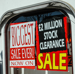 Sale notices in shop window
