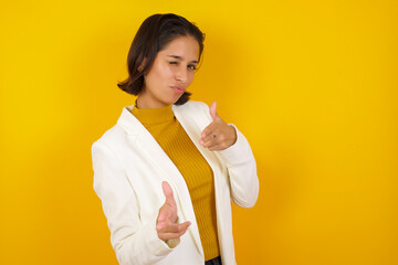 Hey you, bang. Joyful and charismatic good-looking emotive woman with blond curly haircut winking...