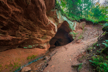 Natural cave in the park at the Rozhdestveno estate, near the town of Gatchina in the Leningrad...