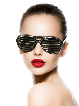 Fashion portrait of  woman wearing black sunglasses with diamonds and red lips