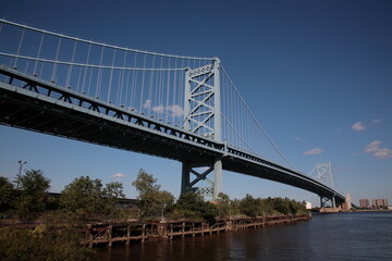 Fototapeta na wymiar View of suspension The Benjamin Franklin Bridge crossing the Delaware River connecting Camden New Jersey from Philadelphia, Pennsylvania, USA
