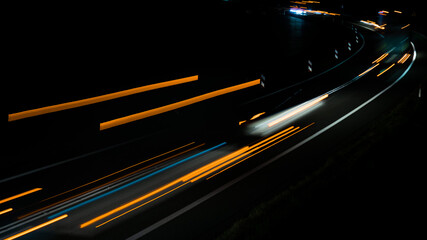 orange car lights at night. long exposure