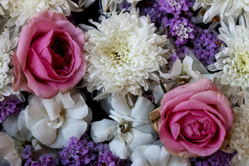 Two Pink rose flowers arrange on white flowers