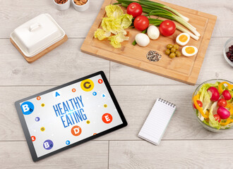 Healthy Tablet Pc compostion with HEALTHY EATING inscription, weight loss concept