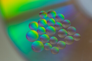 Oil drops in the water create an artistic and imaginatively designed abstract background
