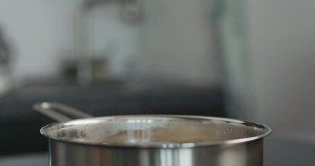 closeup of fusilli boiling in a saucepan - Powered by Adobe