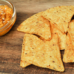 Corn cheese, snacks with sauce on a wooden stand. Beer snack, dish on the menu. Close up.