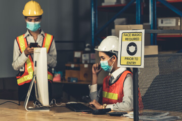 Caution sign in factory warning to industry labor worker to prevent Covid-19 Coronavirus spreading...