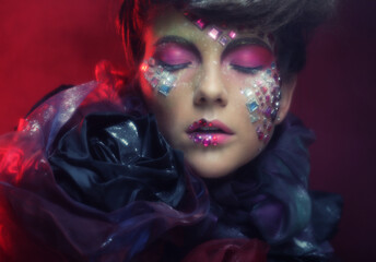 Close up portrait young woman with bright fantasy make up