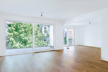 bright empty modern apartment with large windows 