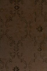 Old yellow wallpaper close up