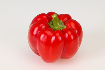 Ripe red bell pepper isolated on white