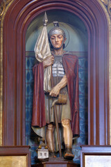 Saint Florian statue on the altar at Saint Nicholas Parish Church in Jastrebarsko, Croatia - obrazy, fototapety, plakaty