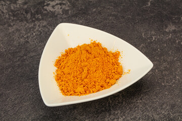 Tumeric powder in the bowl